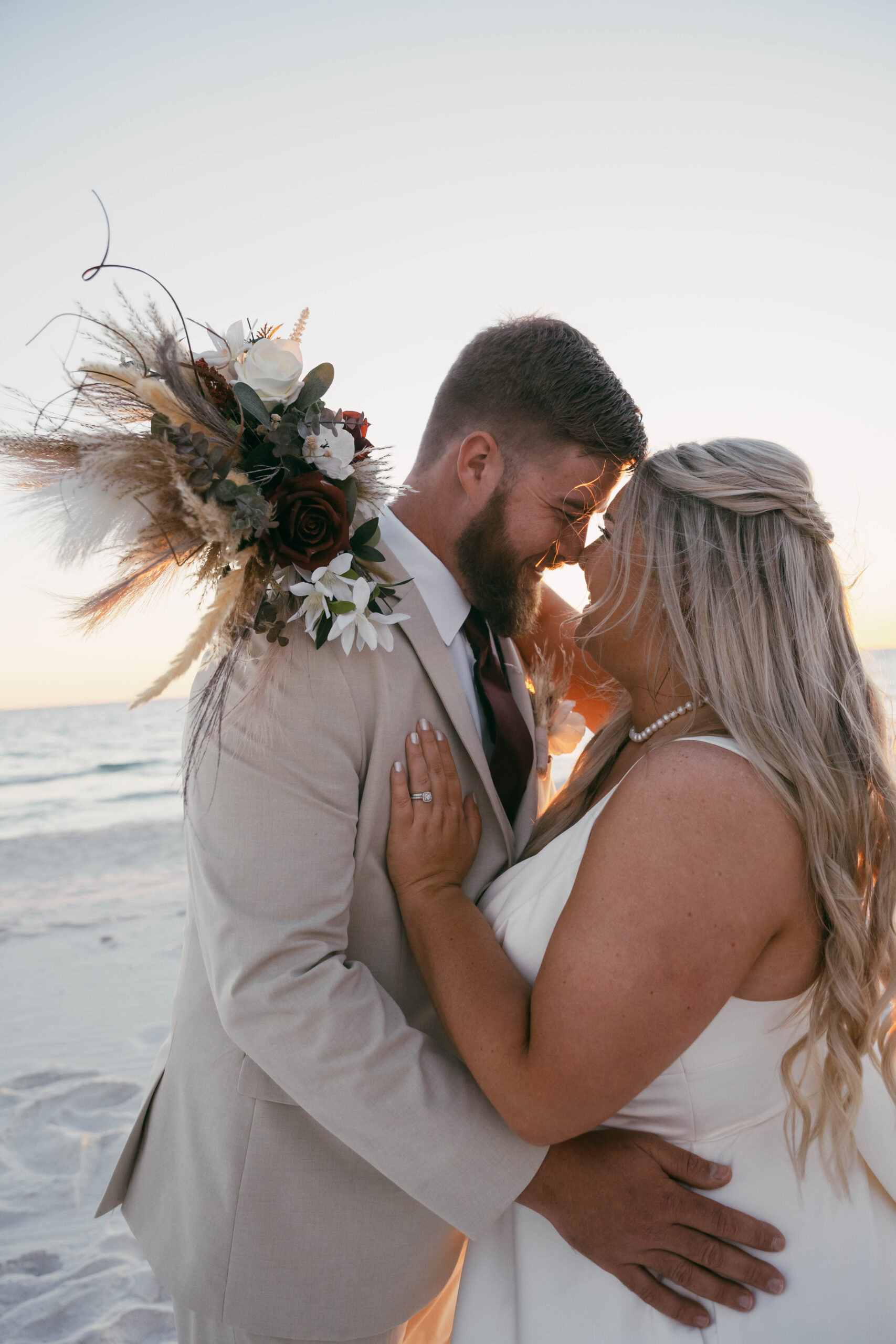 Bride and groom share a private first look on the beach